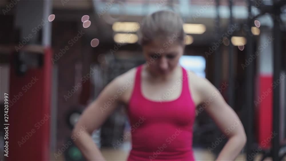Young woman athlete ready to train, portrait in the gym. Young woman athlete ready to train, portrait in the gym.