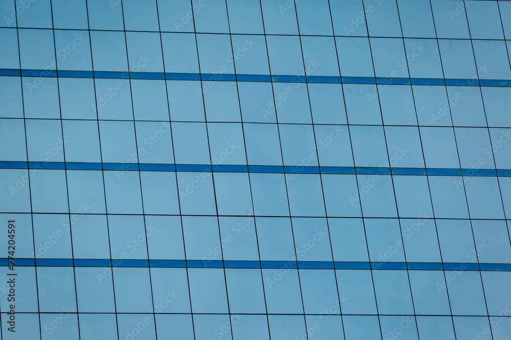 Blue glass windows of office building Blue glass windows of office building