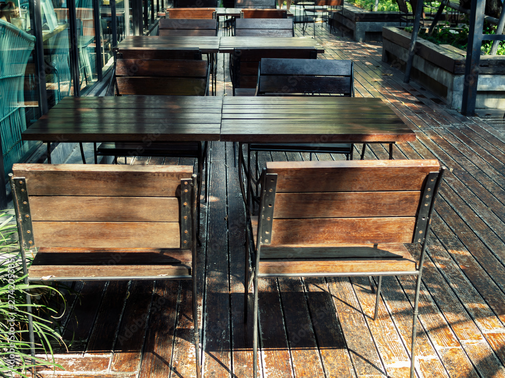Wooden chairs and wooden table on wooden floor Wooden chairs and wooden table on wooden floor