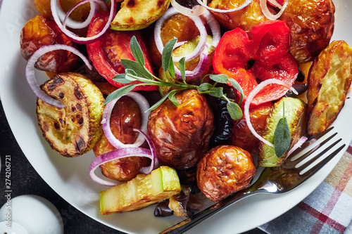 roasted hot vegetables on a white plate
