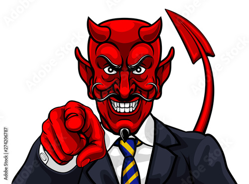 Fototapeta An evil devil or Satan businessman in business suit pointing at the viewer