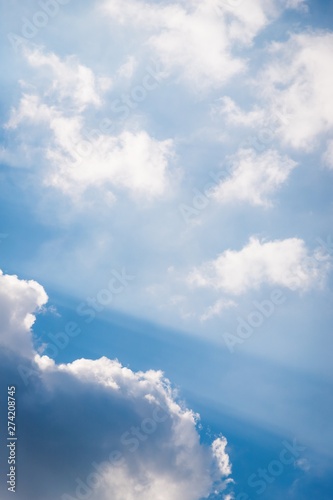 Beautiful white soft fluffy clouds on a sky background. Sunlight  light and shadow