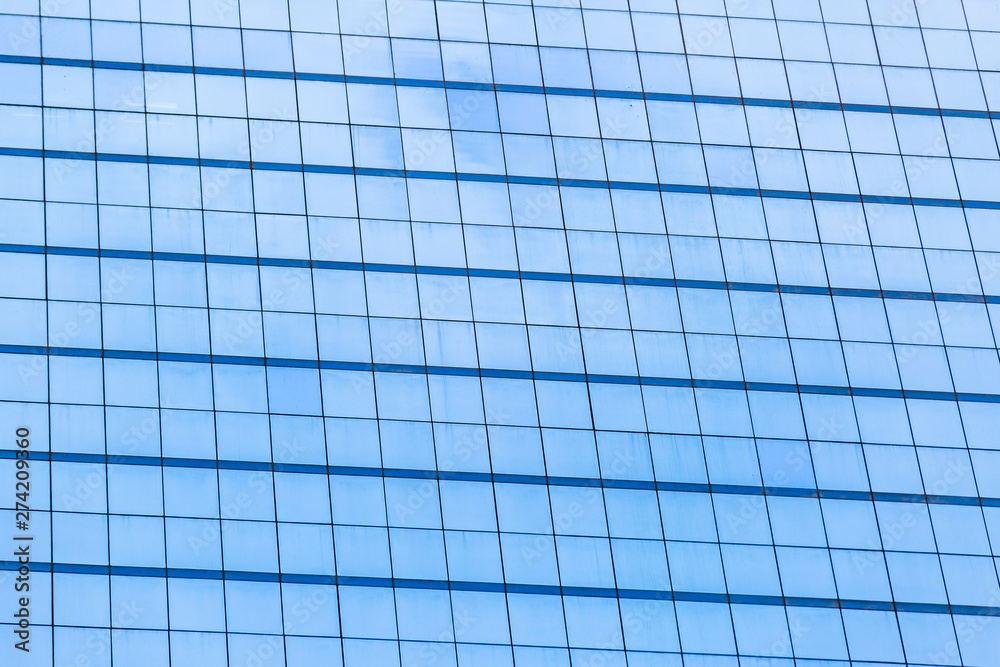 Blue glass windows of office building Blue glass windows of office building