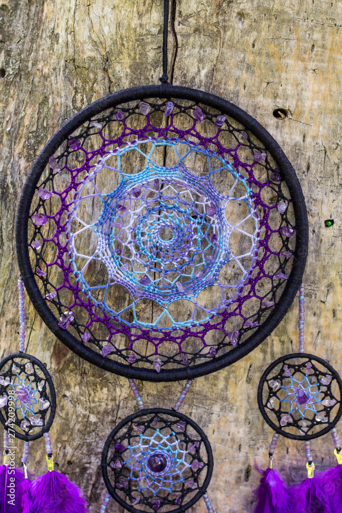 Obraz premium Handmade dream catcher with feathers threads and beads rope hanging