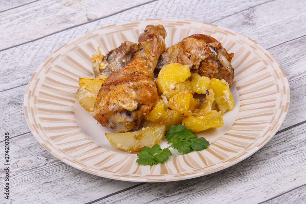 Roasted chicken legs with potato