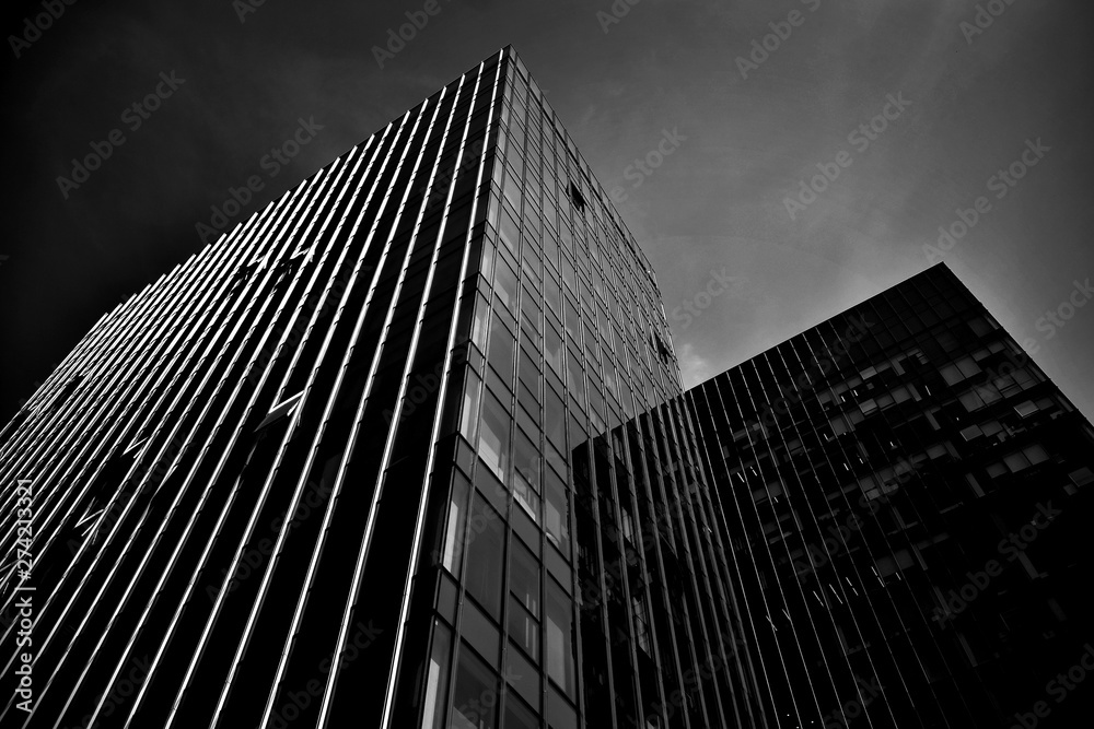 Black glass silhouette of skyscraper at night.The gloomy city of skyscrapers. Black and white.
