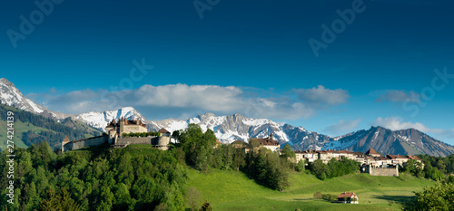 panorama view the historic castle and village of Gruyeres with mountain landscape photo