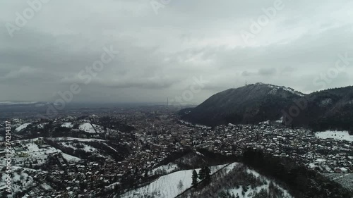 Slow ramp of Romania, Brasov's sorroundings during winter season. Heading towards the city. photo