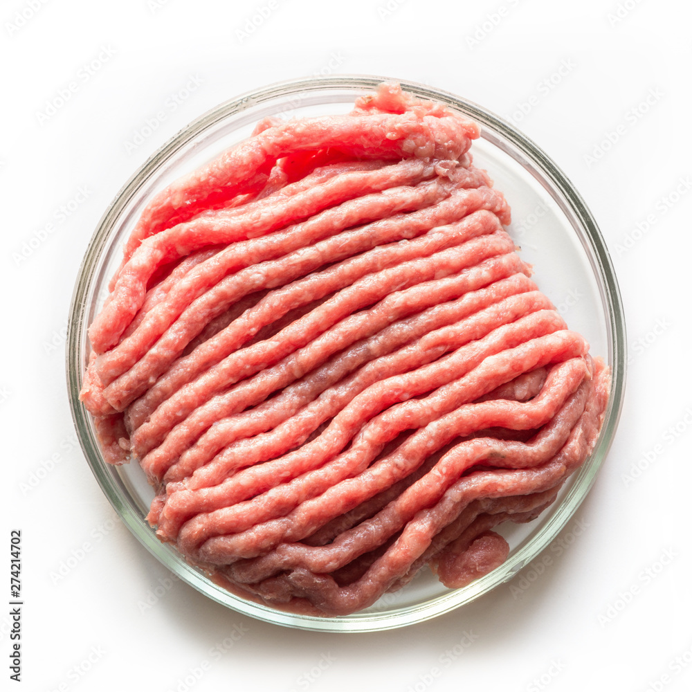 Laboratory studies of artificial meat. Minced meat in glass Petri dish. Square image. Close up. View from above. Chemical experiment.