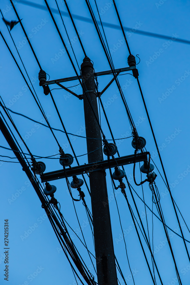 lot wires pole Silhouette in the blue sky lot wires pole Silhouette in the blue sky