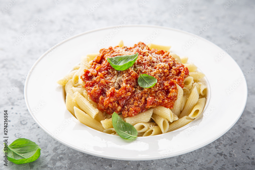 penne pasta with Bolognese sause in white plate penne pasta with Bolognese sause in white plate