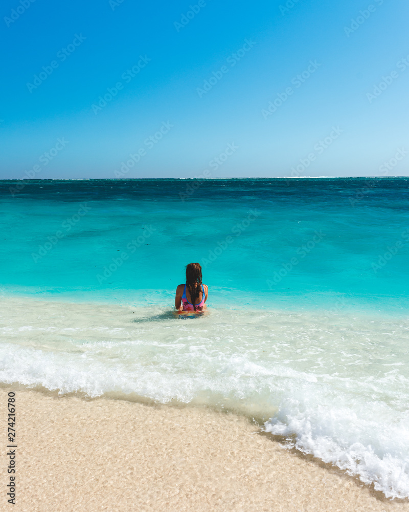 Girl on the turquoise water