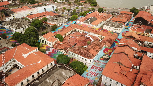 Aerial view Market of Tulhas and historical buildings decorated by the government with flags of sao joao in the center of the city of sao luis do maranhao, brazil.