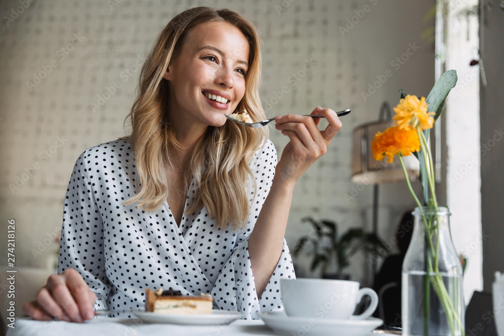 Beautiful young blonde woman sitting at the cafe Beautiful young blonde woman sitting at the cafe