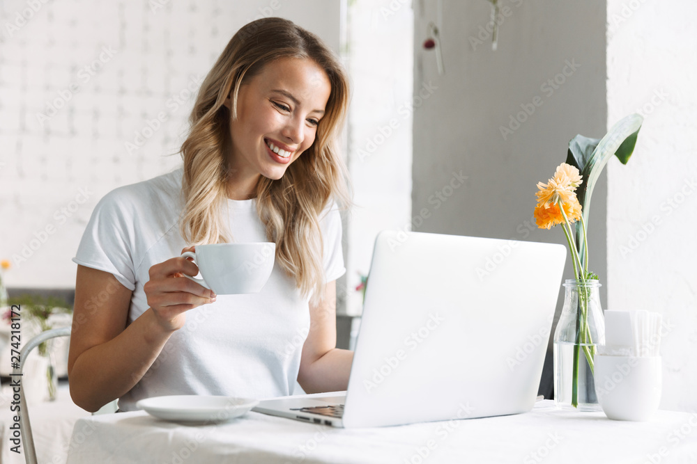 Beautiful young blonde woman sitting at the cafe Beautiful young blonde woman sitting at the cafe
