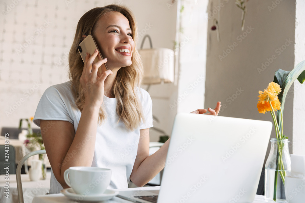 Beautiful young blonde woman sitting at the cafe Beautiful young blonde woman sitting at the cafe