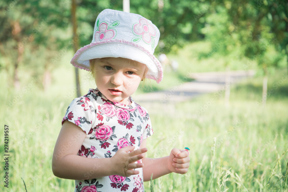 Cute little girl on the meadow in summer day Cute little girl on the meadow in summer day