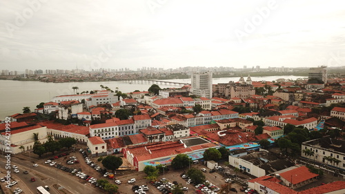 Aerial view Market of Tulhas and historical buildings decorated by the government with flags of sao joao in the center of the city of sao luis do maranhao, brazil.