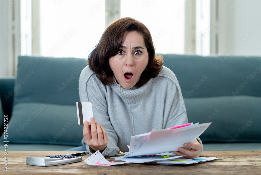 Upset young woman stressed about credit card debts and payments not happy accounting finances Upset young woman stressed about credit card debts and payments not happy accounting finances