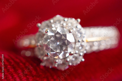 luxury jewelry diamond ring on red fabric background