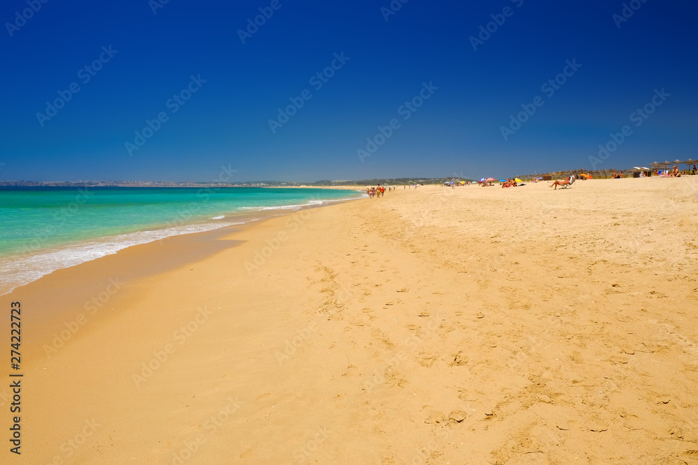 ALVOR, PORTUGAL - MAI 26, 2019: View on the beach Alvor Poente in Algarve, Portugal. ALVOR, PORTUGAL - MAI 26, 2019: View on the beach Alvor Poente in Algarve, Portugal.