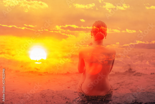 Double exposure of young woman and sunset sky. © Vladimir Arndt