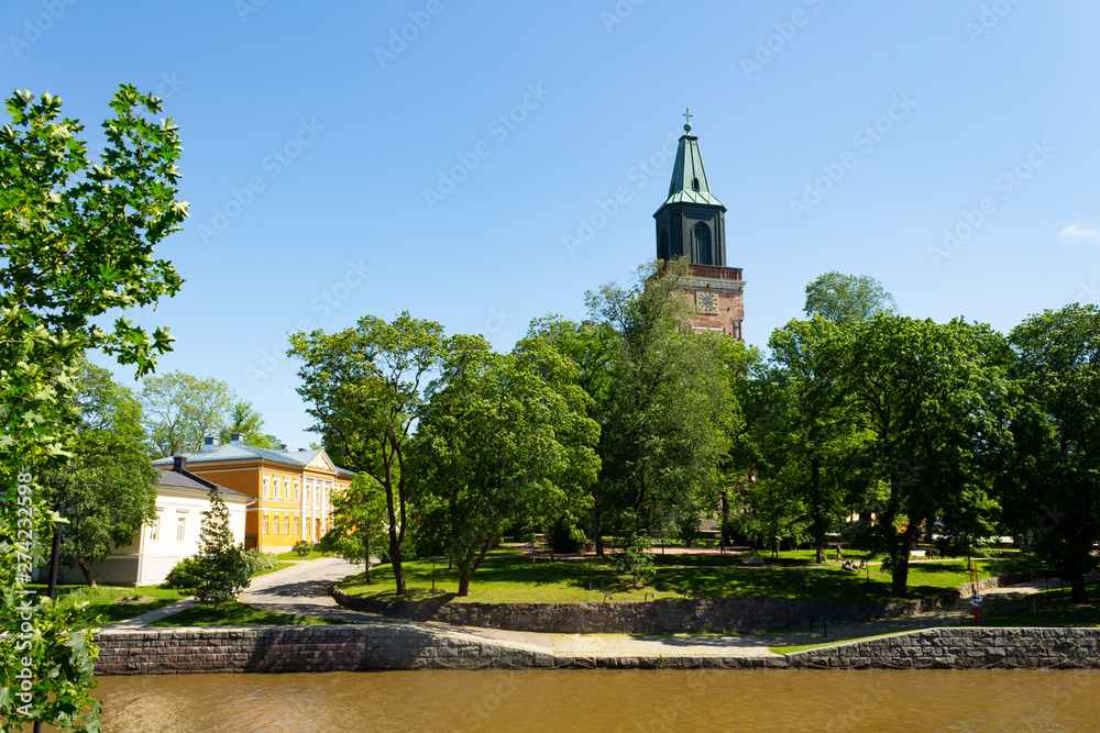 Fototapeta premium Auraioki River and view of the historic 13th century cathedral in Turku Abo on a summer day in Finland.