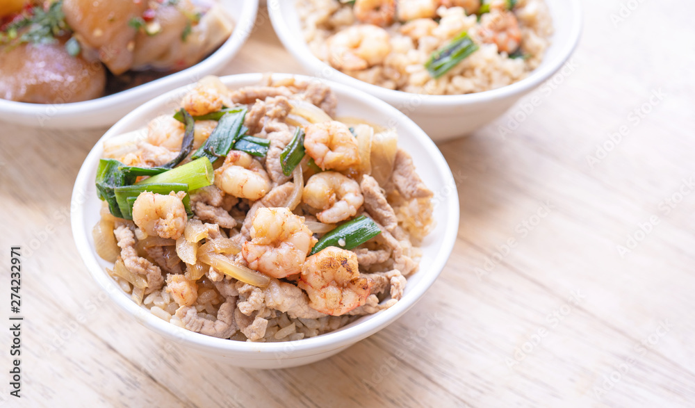 Braised shrimp over rice - Taiwan famous traditional street food. Soy-stewed prawn on cooked rice. Travel concept, top view, copy space, close up