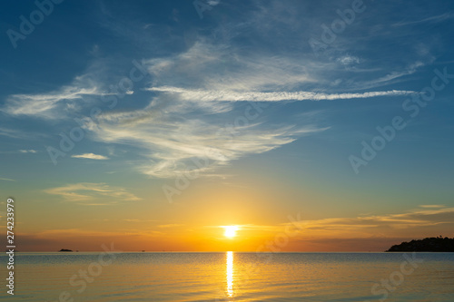 Colorful sunset over calm sea water near tropical beach. Summer vacation concept. Island Phangan  Thailand