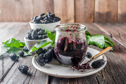 Mulberry Chutney or Jam, with fresh Mulberries, wooden rustic background