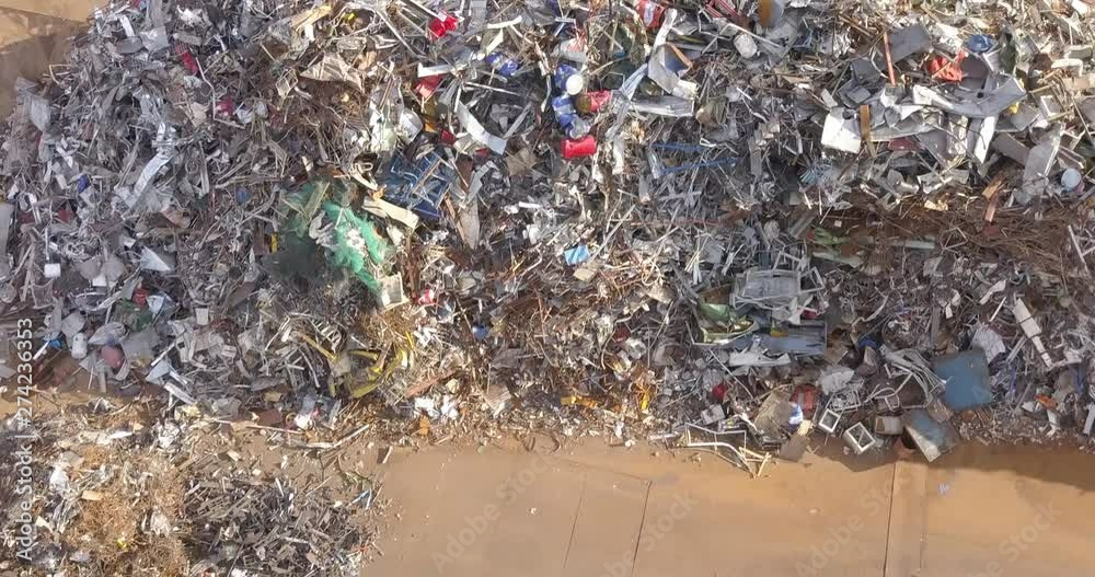 Aerial view of a pile of metallic waste on a recycling area. Aerial view of a pile of metallic waste on a recycling area.