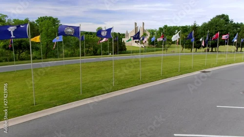 Flying flags on poles at Indiantown Gap National Cemetery, Pennsylvania, flags of the States and Territories of USA photo