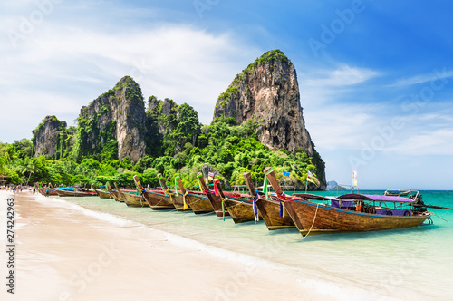 Thai traditional wooden longtail boats and beautiful sand beach. © preto_perola