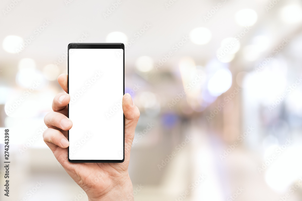 Hand holding mobile smart phone with blank screen Hand holding mobile smart phone with blank screen