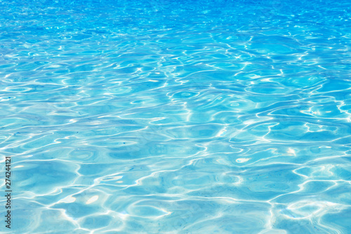 Shining blue water ripple background.