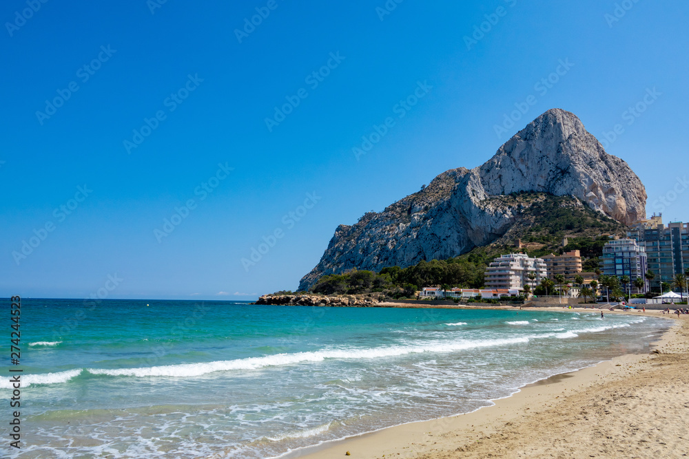 Sand beach and Natural Park of Penyal d'Ifac on background, Calpe, Spain