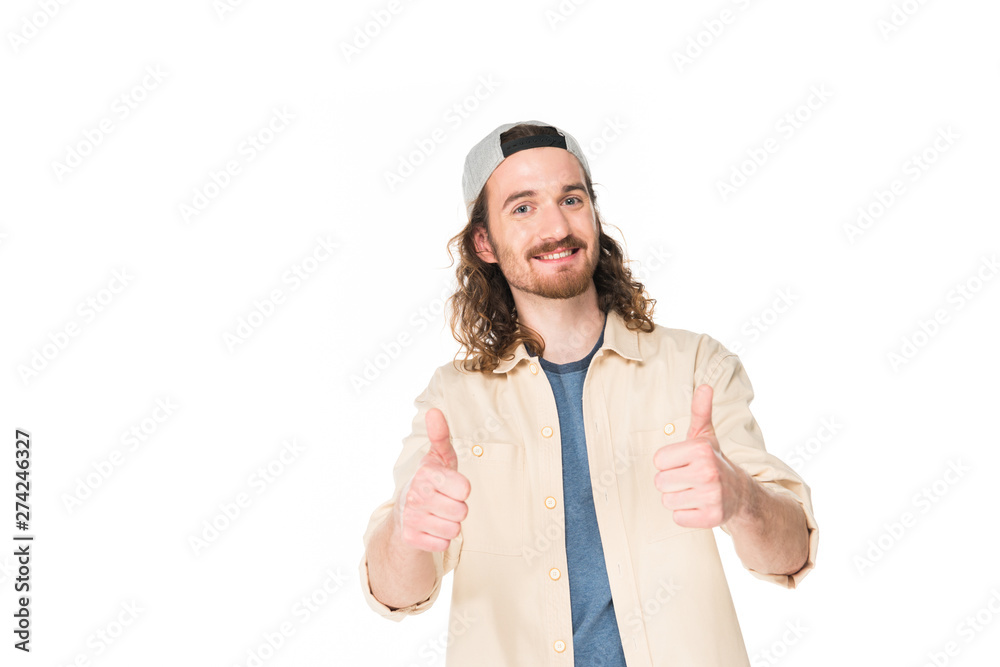 handsome young man showing thumbs up at camera isolated on white handsome young man showing thumbs up at camera isolated on white