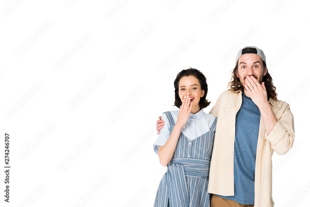 surprised girl and young man standing close to each other isolated on white surprised girl and young man standing close to each other isolated on white