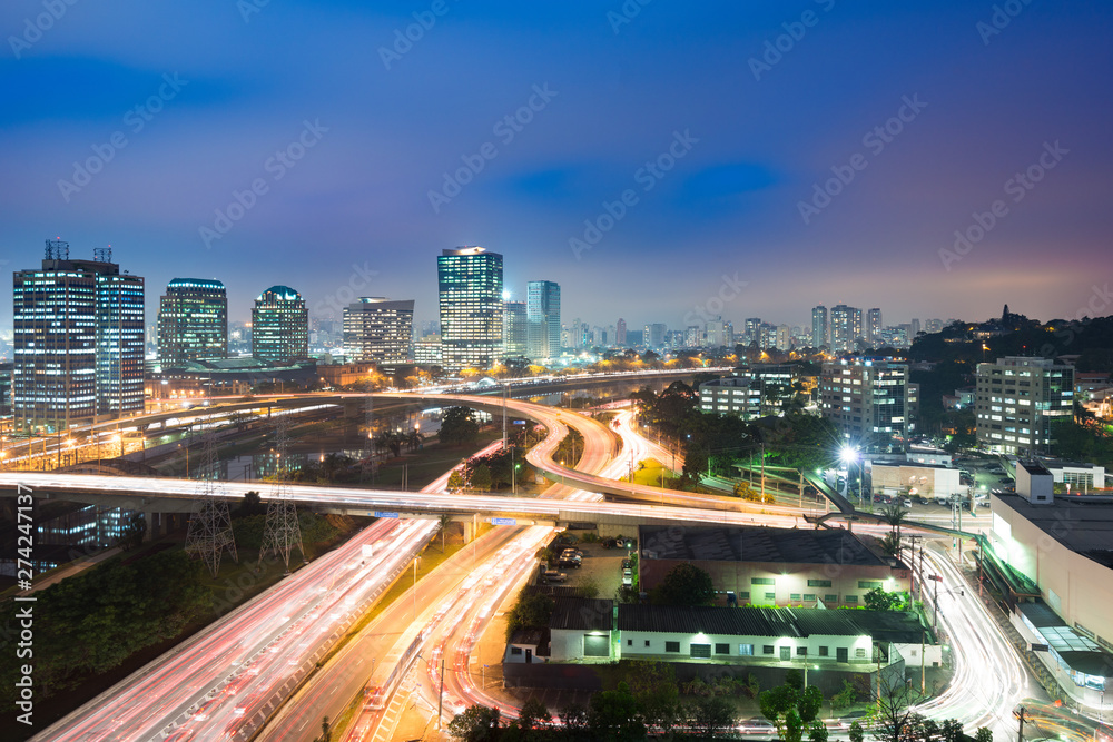 City skyline and traffic on highway at night, Sao Paulo, Brazil