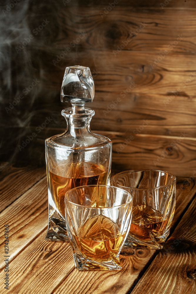 glasses with cognac, whiskey stand on the bar glasses with cognac, whiskey stand on the bar