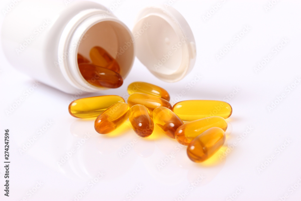 Omega-3 capsules on a white background. Fish oil, healthy supplements Omega-3 capsules on a white background. Fish oil, healthy supplements