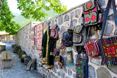 Traditional bags and clothes in the souvenir shop in Sheki, Azerbaijan
