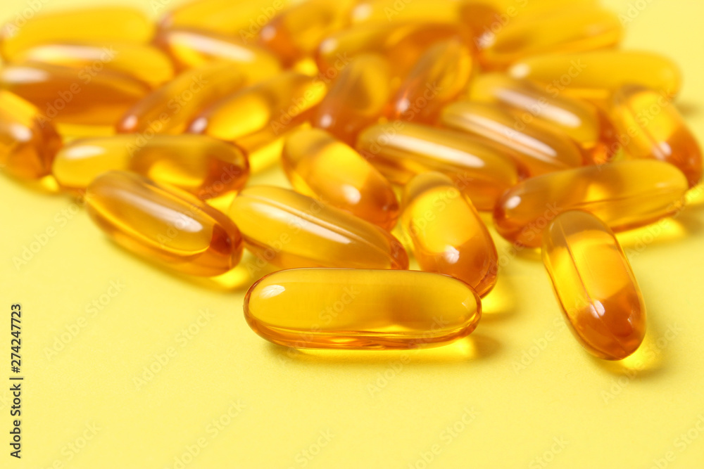Omega-3 capsules on a colored background. Fish oil, healthy supplements Omega-3 capsules on a colored background. Fish oil, healthy supplements