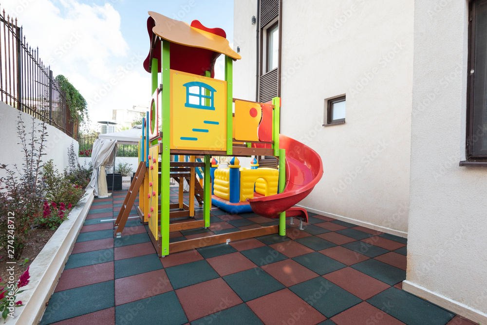 Playground kid zone in a hotel rest territory. Modern children playground, Children playground on yard activities in park