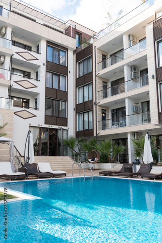 Summer vacation. Swimming pool of luxury hotel with umbrella and chair around. Hotel resort in Bulgaria, Primorsko for travel