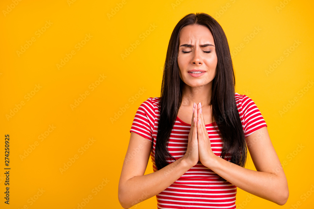 Close up photo of charming lovely attractive youth dreamy hands together palm feel anxious close eyes dressed clothing modern isolated yellow bright background Close up photo of charming lovely attractive youth dreamy hands together palm feel anxious close eyes dressed clothing modern isolated yellow bright background