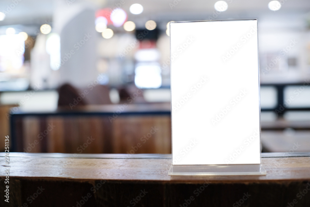Menu frame space for text marketing promotion standing on wood table in Bar restaurant cafeใ Menu frame space for text marketing promotion standing on wood table in Bar restaurant cafeใ