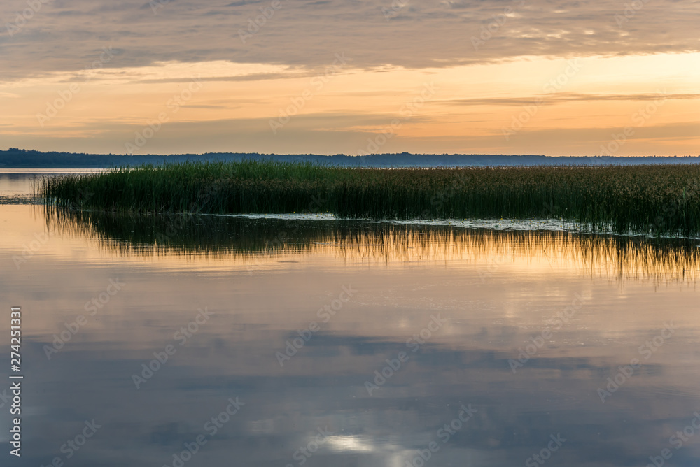 A Still Lake in Rural Latvia at Sunset