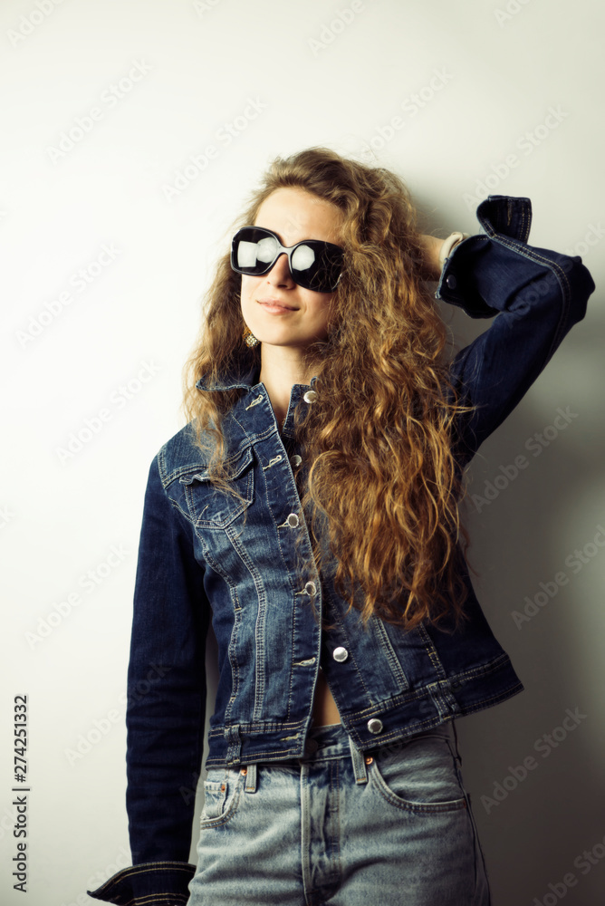 stylish pretty curly girl in a denim jacket stylish pretty curly girl in a denim jacket