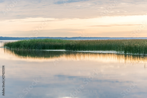 A Still Lake in Rural Latvia at Sunset © JonShore